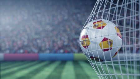 Flag of Spain on the ball in football net. Conceptual 3D rendering