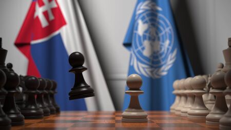 Flags of Slovakia and United Nations behind pawns on the chessboard. Conceptual editorial 3D renderingのeditorial素材