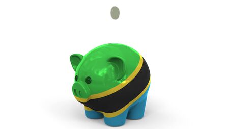 Coins fall into piggy bank painted with flag. Conceptual 3Dの写真素材