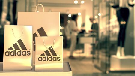 Shopping bags with Adidas logo. Editorial shopping related 3D renderingのeditorial素材