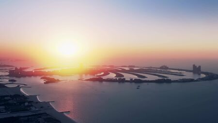 Aerial view of the famous Palm Jumeirah island in Dubai at sunset, the United Arab Emirates UAEの写真素材