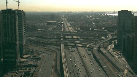 Aerial view of big urban highway intersection. Dubai, UAE
