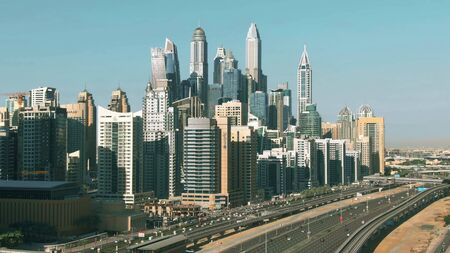 DUBAI, UNITED ARAB EMIRATES - DECEMBER 26, 2019. Aerial shot of Dubai Marina skyscrapers and Sheikh Zayed road, a major city streetのeditorial素材