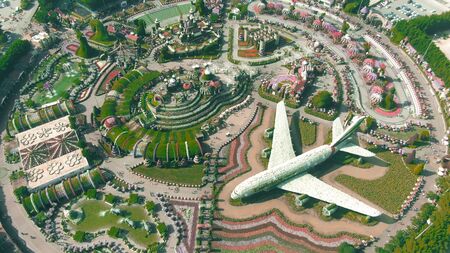 DUBAI, UNITED ARAB EMIRATES - DECEMBER 31, 2019. Aerial down view of the Dubai Miracle Garden with...