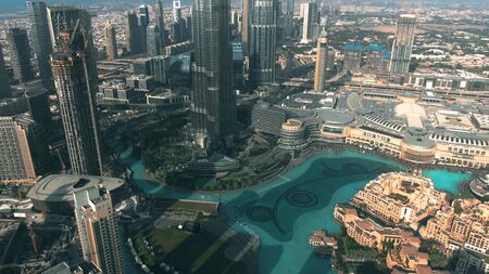 DUBAI, UNITED ARAB EMIRATES - DECEMBER 30, 2019. Aerial view of Burj Khalifa skyscraper foundation the Dubai Fountain within cityscapeのeditorial素材