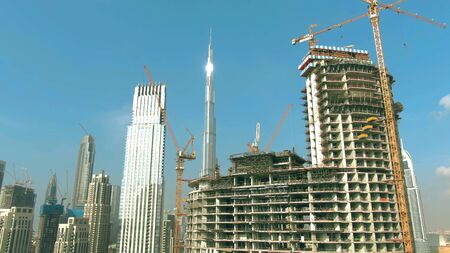 DUBAI, UNITED ARAB EMIRATES - DECEMBER 30, 2019. Aerial shot of the Burj Khalifa tower behind...