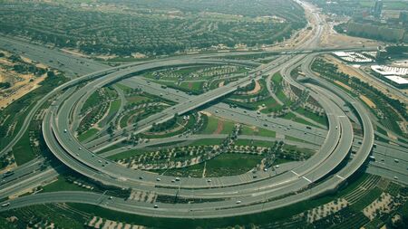 Aerial shot of a big green round highway interchange in Dubai, UAEの写真素材