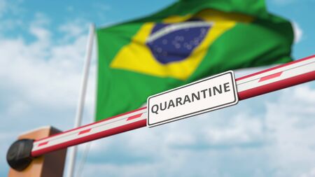 Closed boom gate with QUARANTINE sign on the Brazilian flag background. Border closure or infection related isolation in Brazilの写真素材