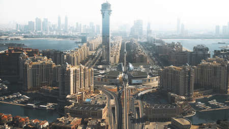 DUBAI, UNITED ARAB EMIRATES - DECEMBER 28, 2019. Aerial shot of the Nakheel Mall and the monorail...