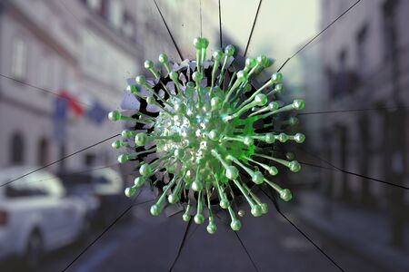 Virus breaks glass with blurred reflection of a European street. Coronavirus outbreak related conceptual 3D renderingの写真素材