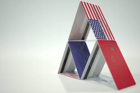 National flag of the United States on credit card house, fictional data. Risky financial decisions related 3D renderingの写真素材
