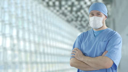Doctor wearing face mask in the modern hospital hallの写真素材