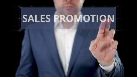 Businessman browses to SALES PROMOTION option on the modern displayの写真素材