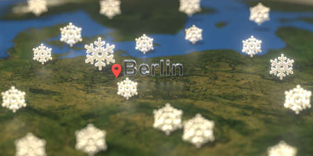 Snowy weather icons near Berlin city on the map, weather forecast related 3D renderingの写真素材