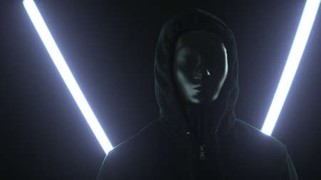 Anonymous rioter wearing black mask and hood in front of glowing lights. Protest or secrecy concepts