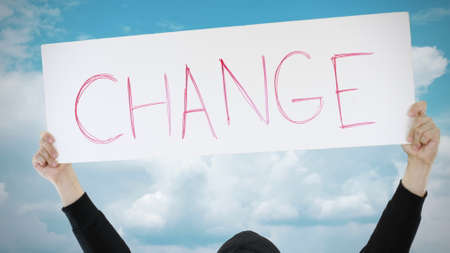 CHANGE text on a placard against blue skyの写真素材