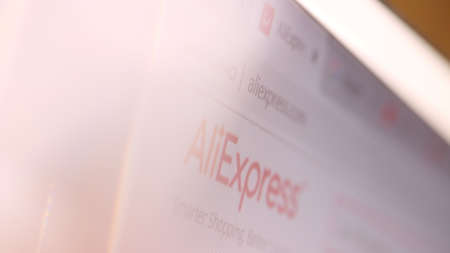 AliExpress domain name in browser and logo on the computer screen. Editorial macro shot
