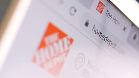 The Home Depot domain name in browser and logo on the computer screen. Editorial macro shot