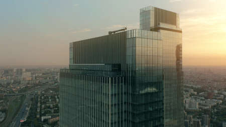 Aerial view of a generic business skyscraper roof on Moscow cityscape background