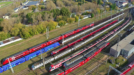 MOSCOW, RUSSIA - OCTOBER 2, 2020. Aerial tracking shot of the red double decker Aeroexpress train,...