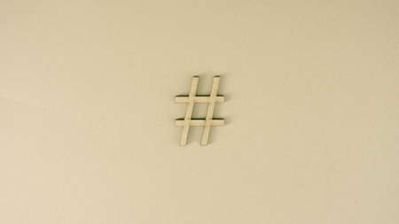 Hashtag symbol made of recycled cardboard on the table. Social media conceptの写真素材
