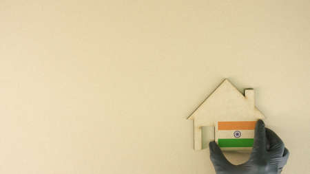 Cardboard house icon with flag of India, real estate market conceptの写真素材
