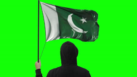 Flag of Pakistan and unknown man, isolated on green background