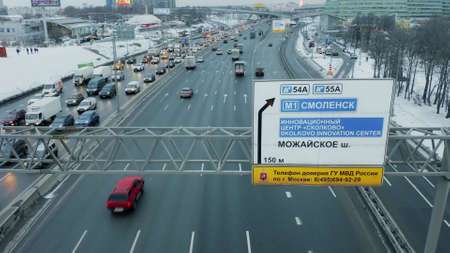 MOSCOW, RUSSIA - JANUARY 29, 2021. Aerial view of a road sign to Mozhayskoye highway and Skolkovo turn and traffic jam at rush hourのeditorial素材