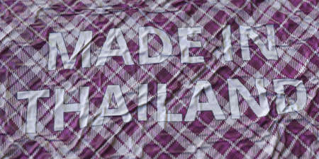 MADE IN THAILAND text printed on a fabric, national textile production conceptual 3d rendering