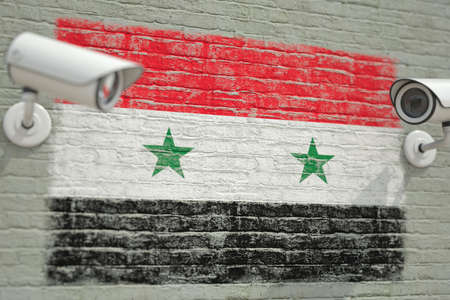 Wall with national flag of Syria and CCTV cameras. Privacy or surveillance system related conceptual 3D renderingの写真素材