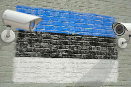 Wall with national flag of Estonia and CCTV cameras. Privacy or surveillance system related conceptual 3D renderingの写真素材