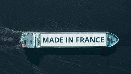 MADE IN FRANCE text on a cargo ship, aerial view