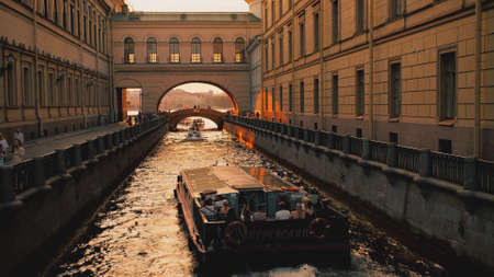 SAINT PETERSBURG, RUSSIA - JULY 13, 2021. The tour boats at the Neva river and channel confluenceのeditorial素材