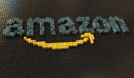 Plastic toy blocks compose logo of AMAZON, editorial conceptual 3d renderingのeditorial素材