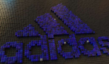 Plastic toy blocks compose logo of ADIDAS, editorial conceptual 3d renderingのeditorial素材