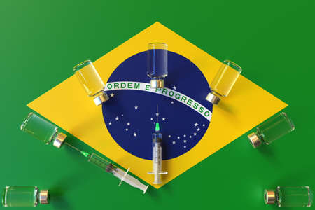 Syringes and medical vials on the flag of Brazil. Vaccination related conceptual 3D renderingの写真素材
