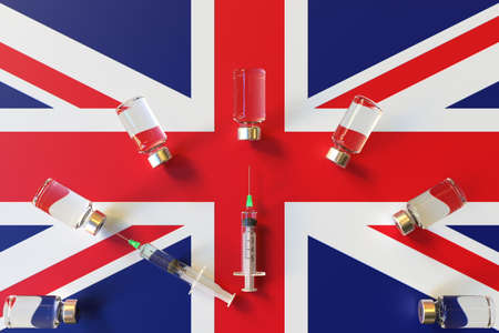 Syringes and medical vials on the flag of Great Britain. Vaccination related conceptual 3D renderingの写真素材