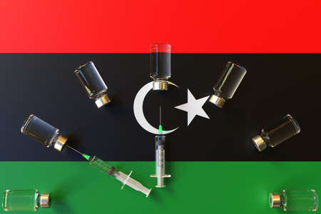 Glass vials and syringes on the flag of Libya. Vaccination related conceptual 3D renderingの写真素材