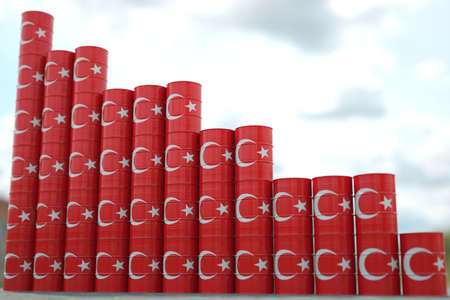 Flag of Turkey on oil barrels forming downward trend. Petrochemical industry crisis or sanctions concept, 3D renderingの写真素材