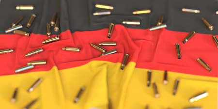 Scattered bullet shells on the flag of Germany. Crime or violence related 3D rendering