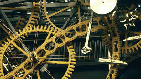 Big clock mechanism with turning cogwheels and gears in action