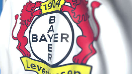 Waving flag with Bayer Leverkusen football club logo, close-up. Editorial 3D renderingのeditorial素材