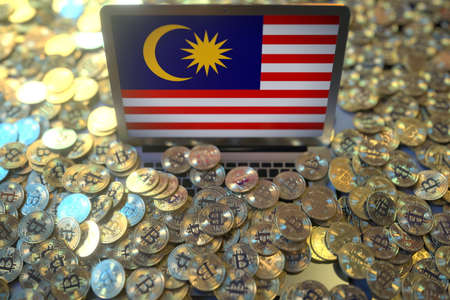 Computer with flag of Malaysia and pile of bitcoins. National regulations and cryptocurrency mining conceptual 3d renderingの写真素材