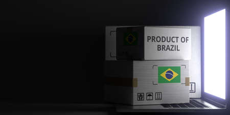 PRODUCT OF BRAZIL text and flag sticker on the boxes on the laptop on dark background. 3D renderingの写真素材
