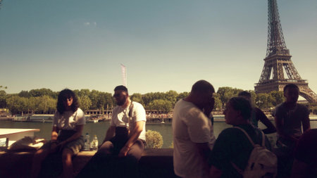 PARIS, FRANCE - JULY 14, 2022. Crowded Seine river embankment opposite to famous Eiffel Towerのeditorial素材