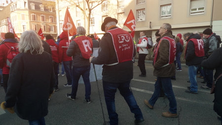 MULHOUSE, FRANCE - FEBRUARY, 2023 Senior protester marching against retirement age increaseのeditorial素材
