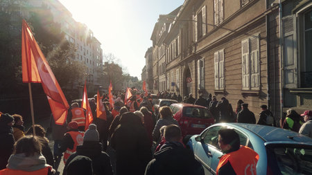 MULHOUSE, FRANCE - FEBRUARY 7, 2023 French Democratic Confederation of Labour protesters walk down the street in Mulhouseのeditorial素材