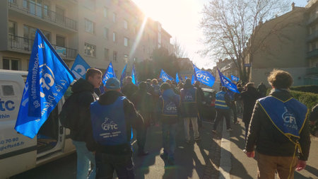 MULHOUSE, FRANCE - FEBRUARY 7, 2023 French Confederation of Christian Workers or CFTC protesters walk down the streetのeditorial素材