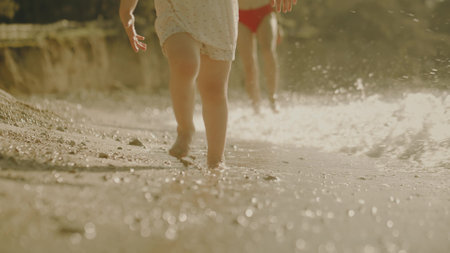 Mom and her baby spend time on the beach together. Summer vacation