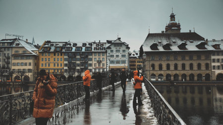LUCERNE, SWITZERLAND - DECEMBER 15, 2022. Embankment view involving Rathaus Stadt Luzern or Townhall from the Rathaussteg bridge in the centreのeditorial素材